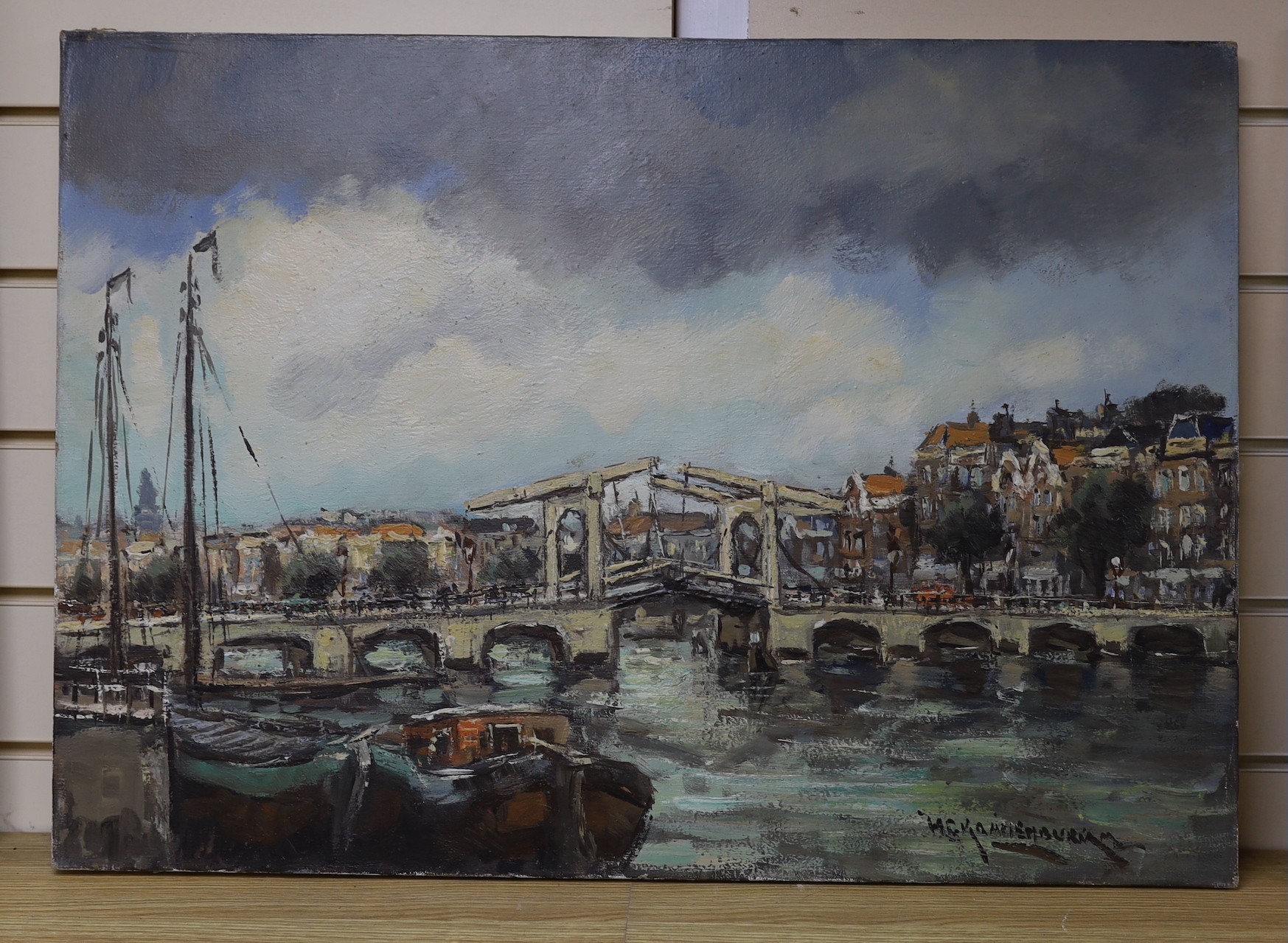 Dutch School, oil on canvas, Bridge in Amsterdam, indistinctly signed, 50 x 70 cm. unframed.